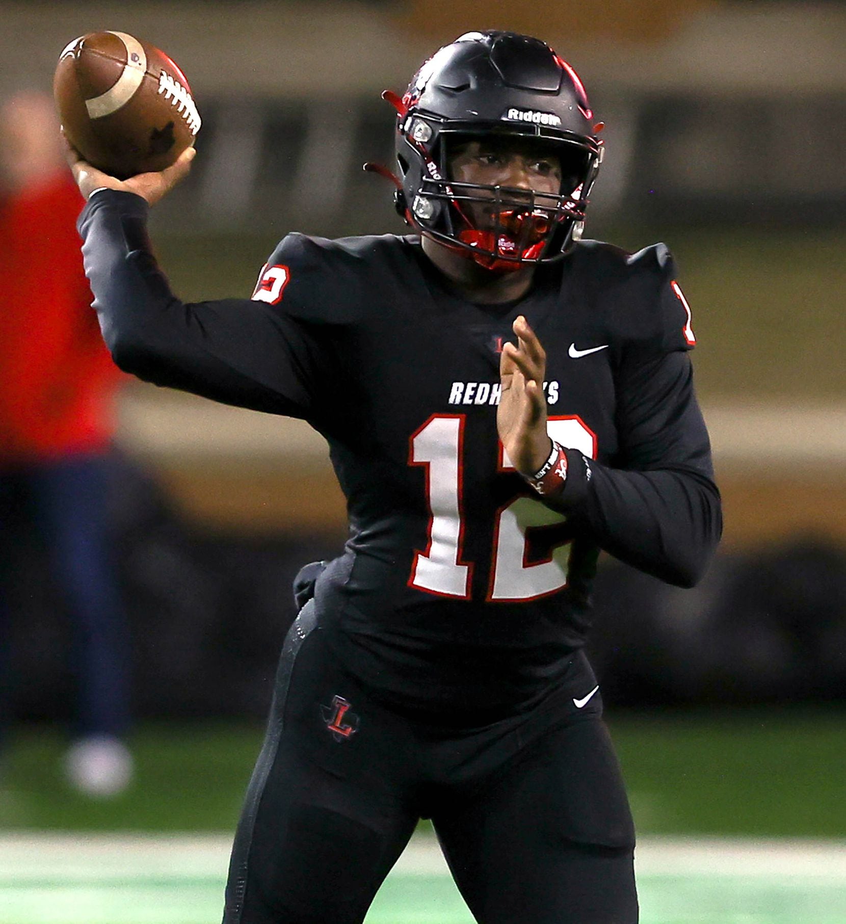 Frisco Liberty quarterback Keldric Luster attempts a pass against Aledo during the first...
