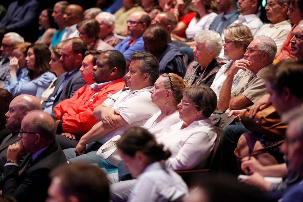 The audience listens to Dallas City Council member Scott Griggs and State Rep. Eric Johnson,...