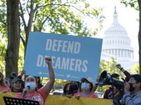 People rally outside the Capitol in support of the Deferred Action for Childhood Arrivals...