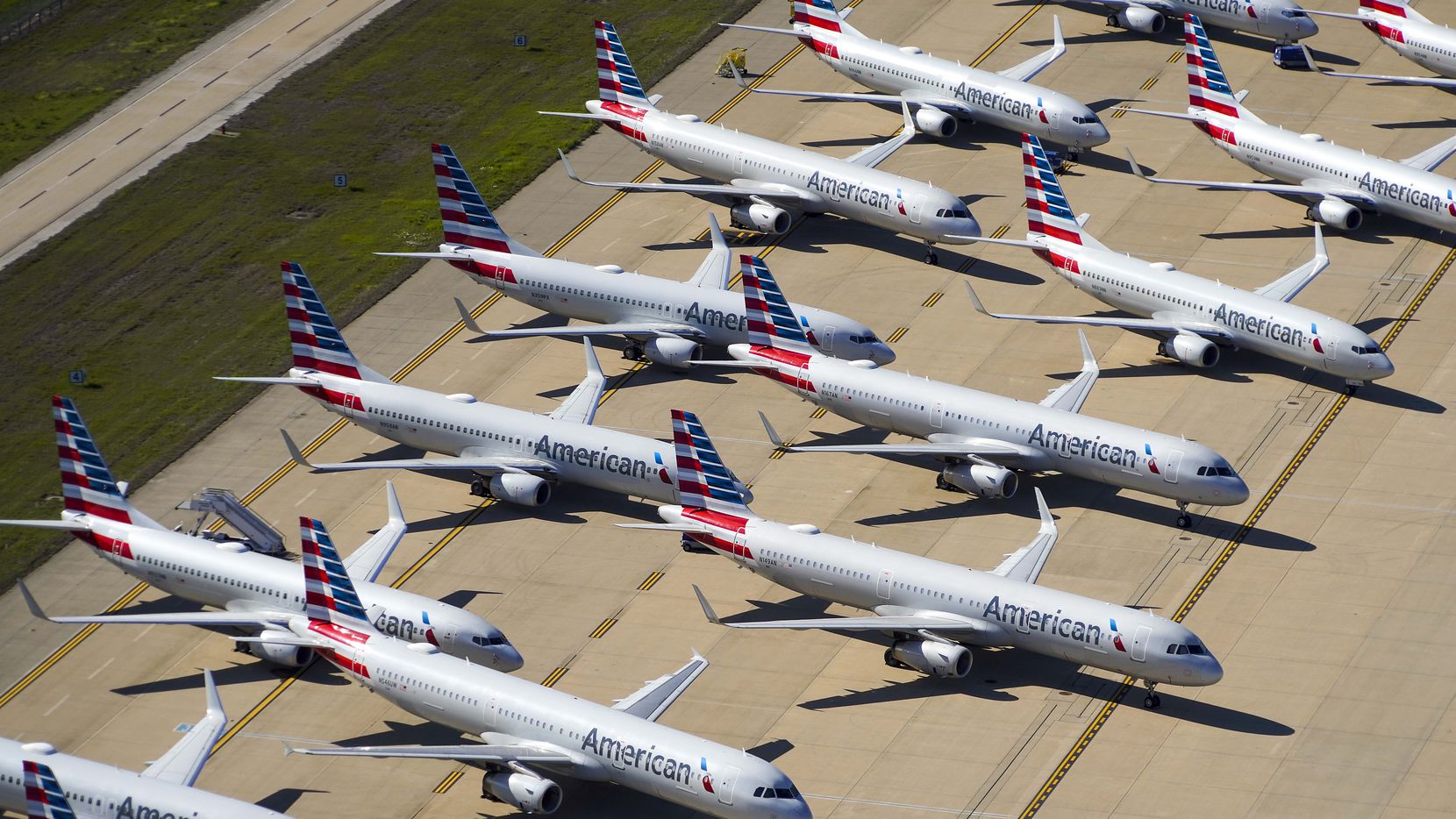 Aerial view of some of the 25 American Airlines aircraft parked on the ramp to the south of...