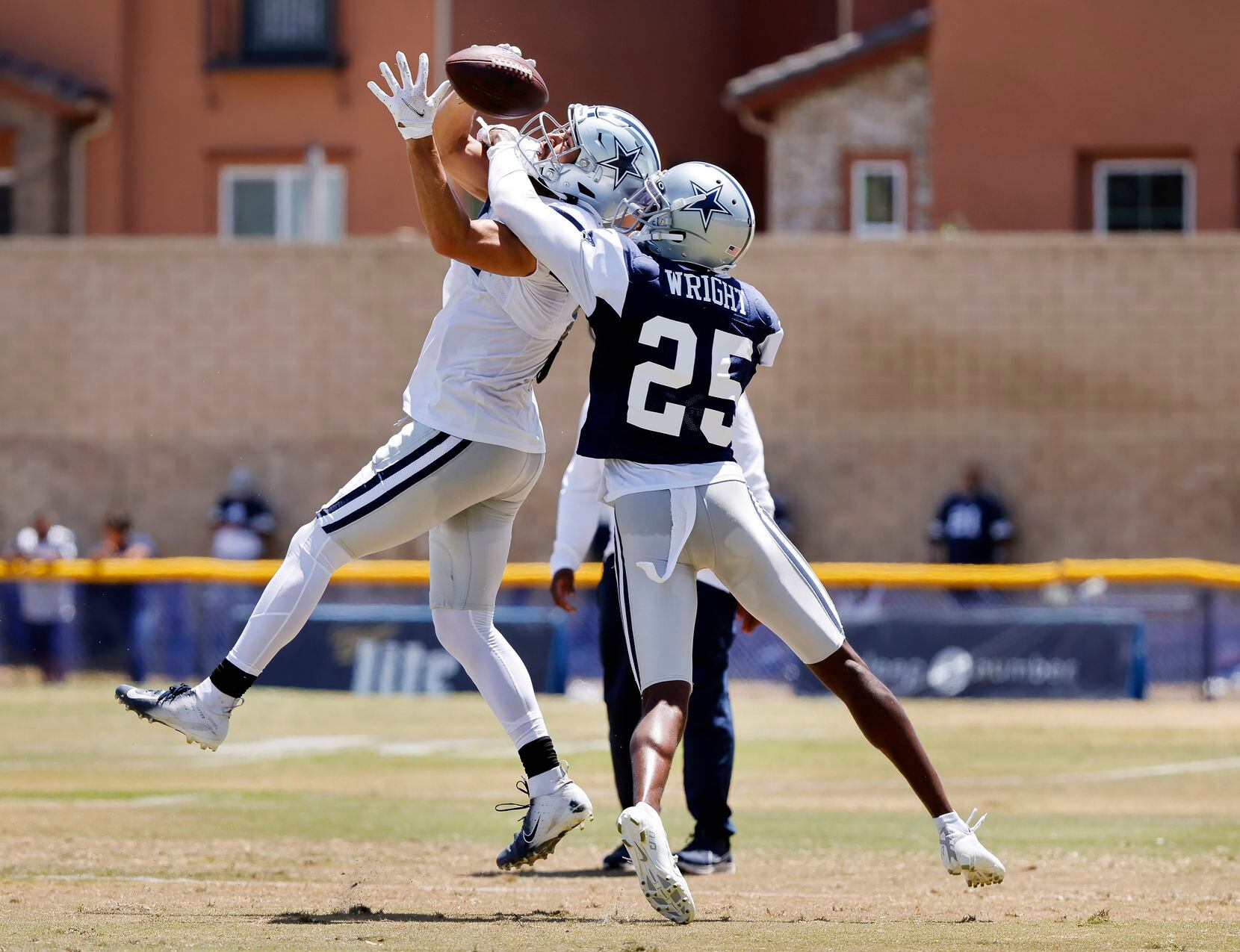 Dallas Cowboys cornerback Nahshon Wright (25) brews up a pas intended for wide receiver Simi...