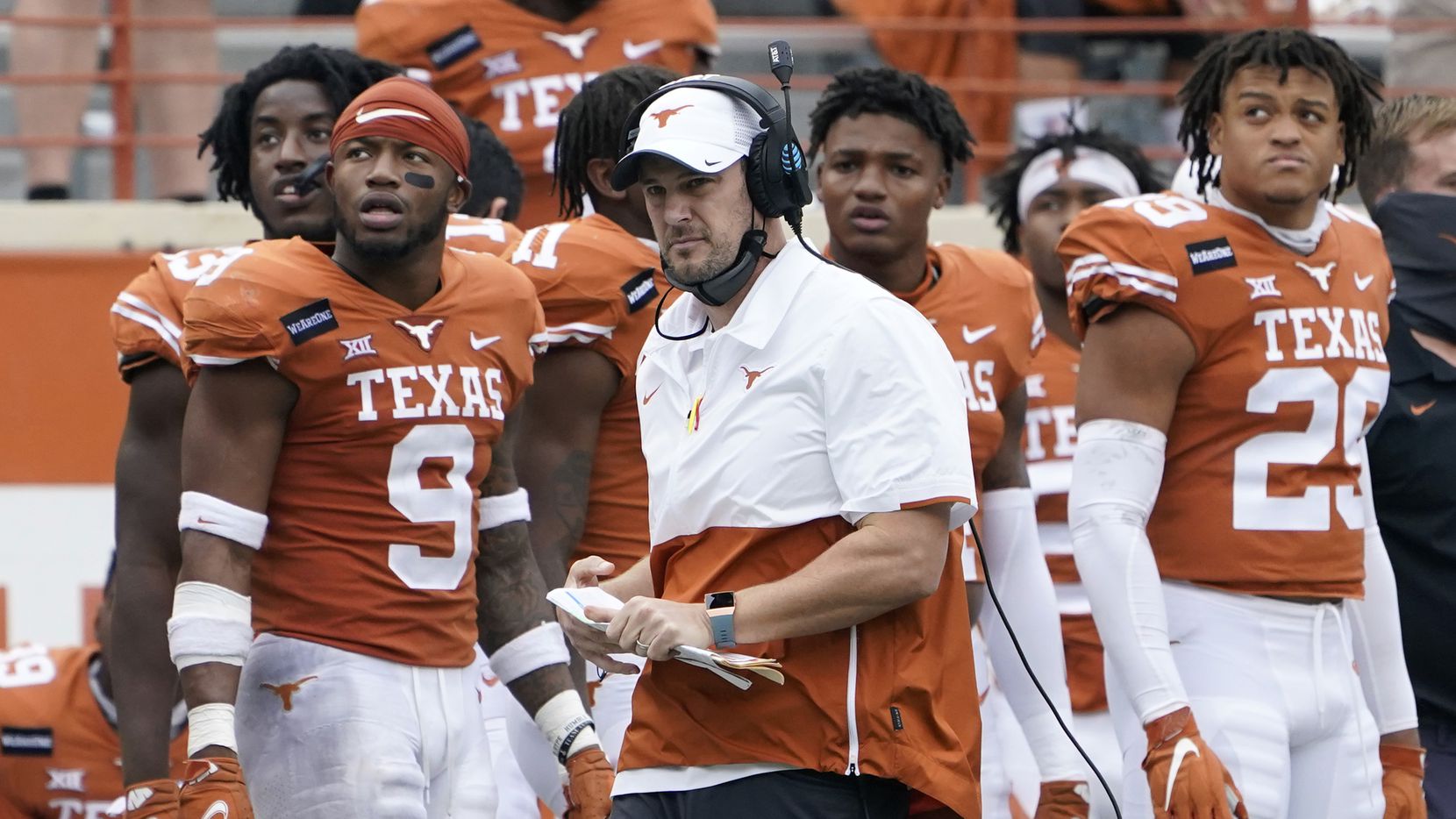 Texas head coach Tom Herman, center, on the side lines during the second half of an NCAA college football game against Iowa State, Friday, Nov. 27, 2020, in Austin, Texas. (AP Photo/Eric Gay)