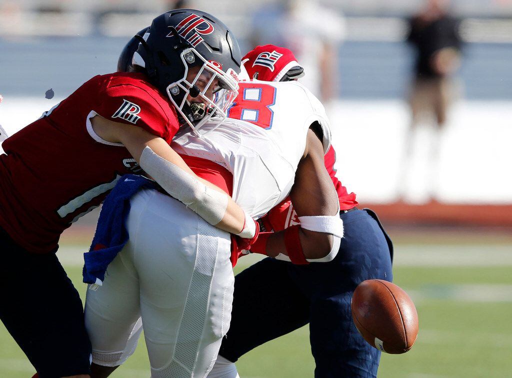 Plano John Paul II's Jacob Turbidy (16) and Terrance Brooks (26) force Parish Episcopal's Cauren Lynch (28) to fumble the ball during the first half of play at the TAPPS Division I state championship game at Waco Midway's Panther Stadium in Hewitt, Texas on Friday, December 6, 2019. (Vernon Bryant/The Dallas Morning News)