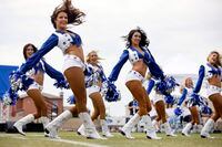The Dallas Cowboys Cheerleaders perform during the Cowboys training camp opening ceremonies...
