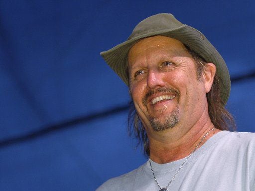 ORG XMIT: *S0427076111* Jimmy LaFave smiles to the crowd during WoodyFest, the Woody Guthrie Festival in Okemah, Oklahoma, Saturday, July 11, 2009. Bill Waugh/Special Contributor