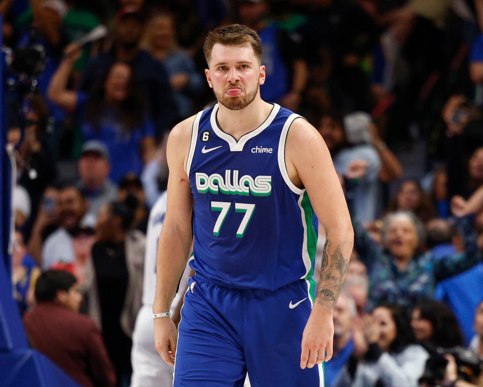 Dallas Mavericks guard Luka Doncic (77) reacts after making a shot during the second half of...