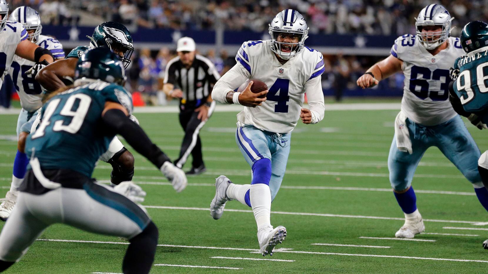 Dallas Cowboys quarterback Dak Prescott (4) scrambles to the two-yard-line during the second half of a NFL football game against the Philadelphia Eagles High at AT&T Stadium in Arlington on Monday, September 27, 2021. (John F. Rhodes / Special Contributor) 