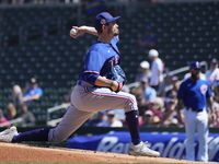 Texas Rangers starting pitcher Andrew Heaney throws against the Chicago Cubs during the...