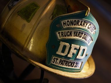 An honorary Dallas Fire Department helmet hangs on the wall at Truck Yard in Dallas. The bar...