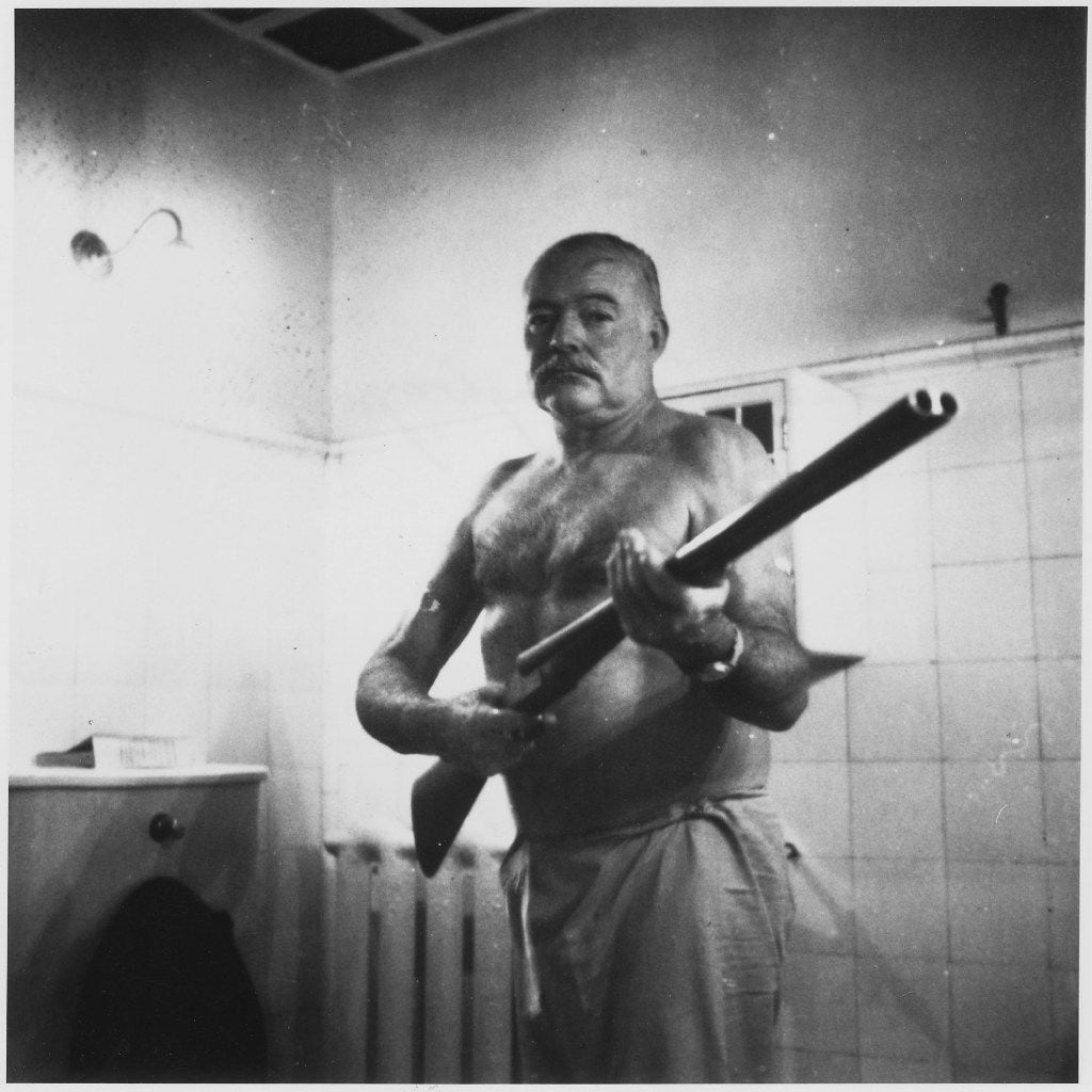 Ernest Hemingway on guard at Finca Vigia, his home outside Havana. The Cuban Revolution led him to fear looters and kidnapping. From Writer, Sailor, Soldier, Spy,  by Nicholas Reynolds.

