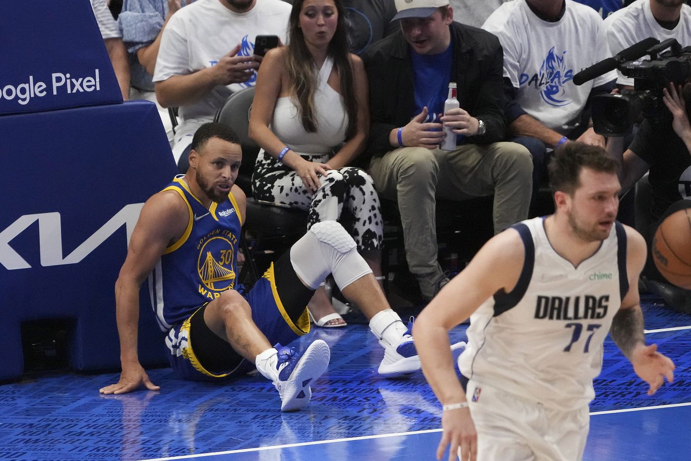Golden State Warriors guard Stephen Curry (30) gets up from the floor after missing a shot...