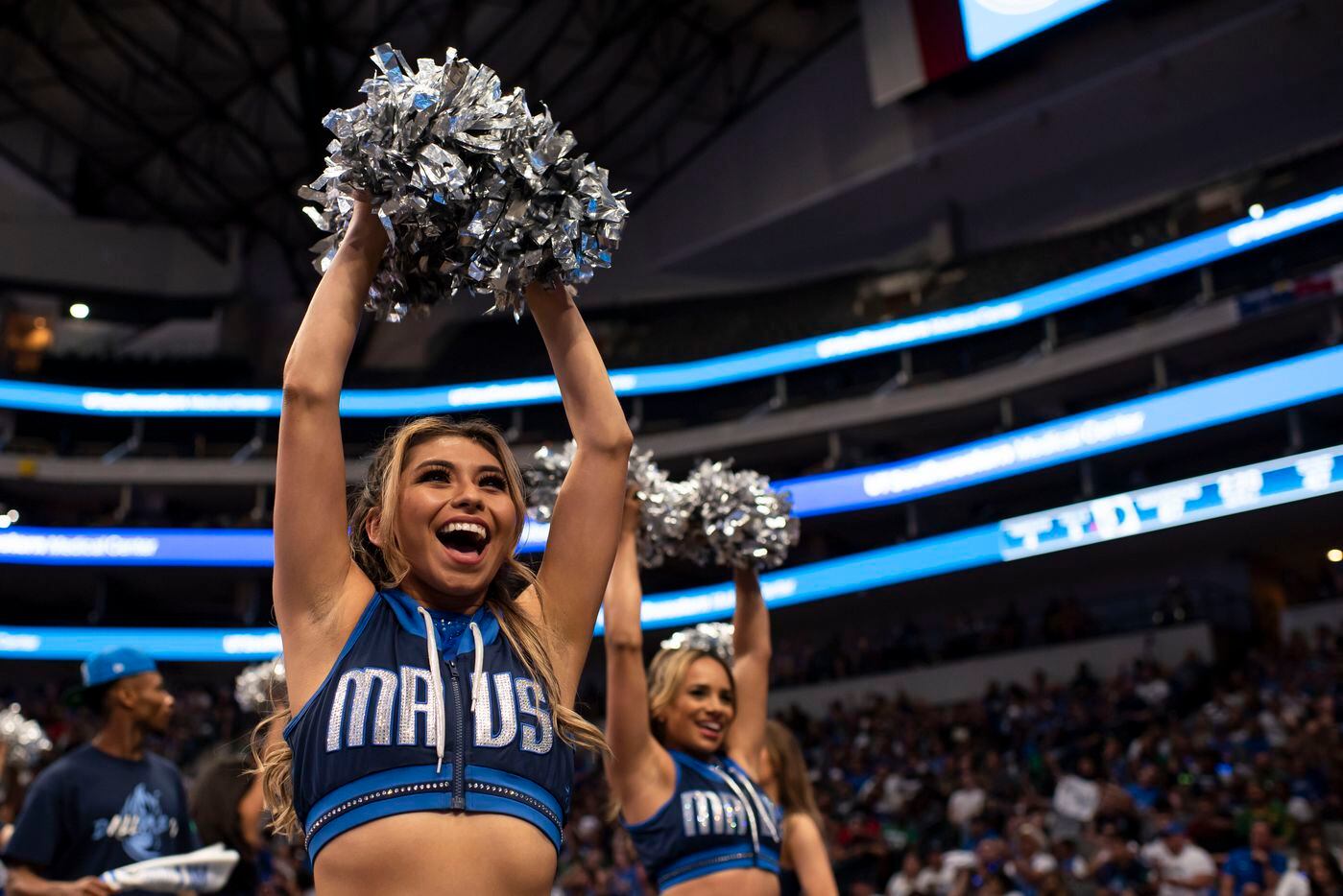 A Mavs dancer gets the fans excited during the Dallas Mavericks official watch party for...