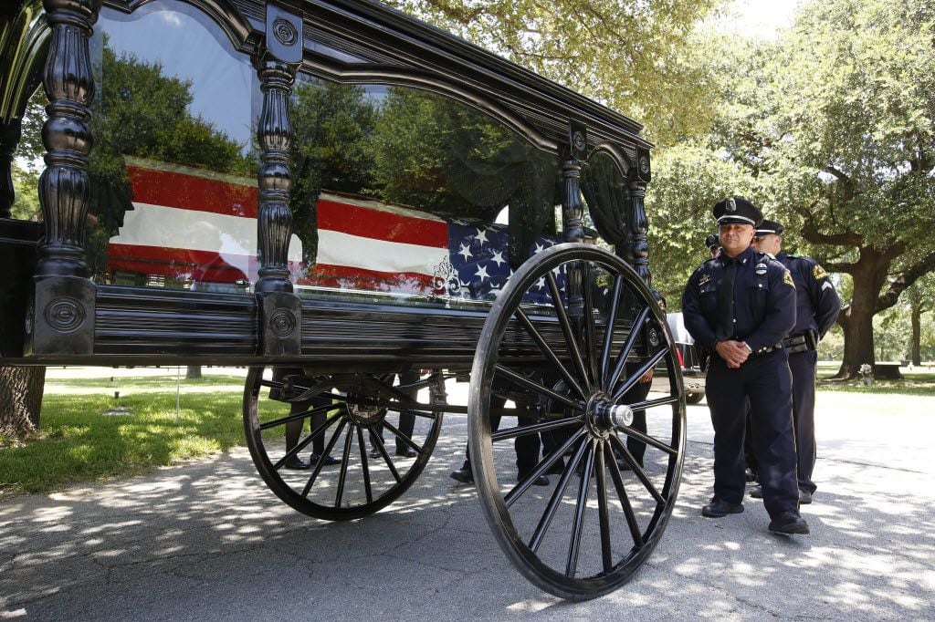 Burial services are held for Dallas police Sr. Cpl. Lorne Ahrens, killed with four other officers in last week's shooting ambush, at Restland Memorial Park in Dallas, on Wednesday, July 13, 2016. (Barbara Davidson/Los Angeles Times/TNS)