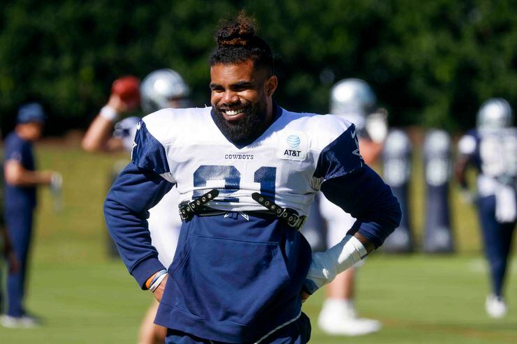 Dallas Cowboys running back Ezekiel Elliott (21) smiles during a team practice ahead of...
