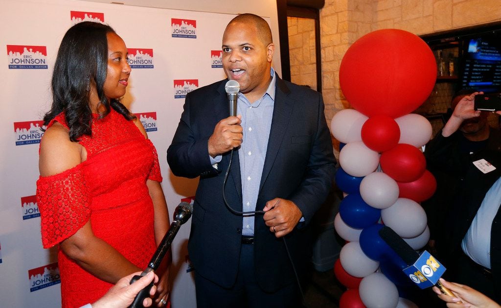 Dallas mayoral candidate Rep. Eric Johnson (right) delivers remarks on his early voting...