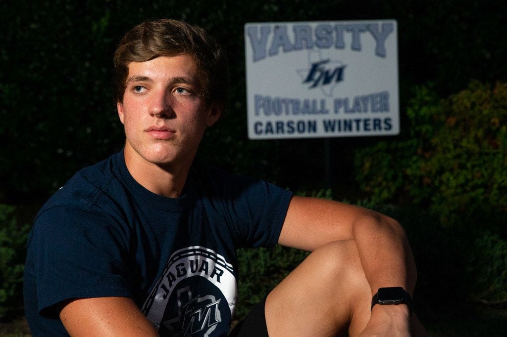 Flower Mound High School wide receiver Carson Winters, 18, poses for a portrait outside his...