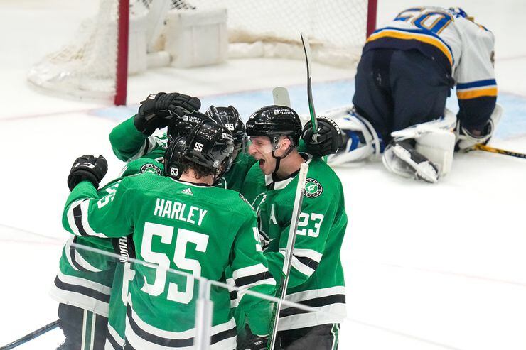 Dallas Stars left wing Mason Marchment (left) celebrates with right wing Evgenii Dadonov...