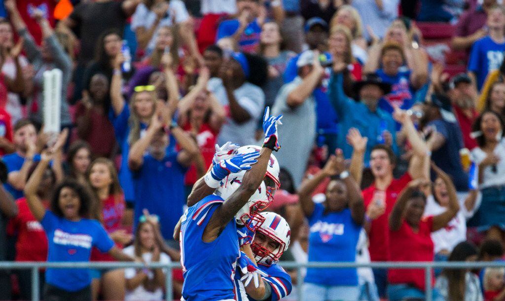 Southern Methodist Mustangs celebrate a touchdown by Southern Methodist Mustangs wide...