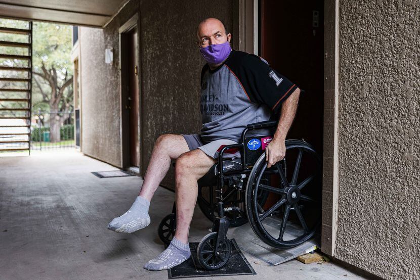 Tom Strzyz uses a ramp that he paid for at the Wildflower Apartments in Dallas on Thursday,...
