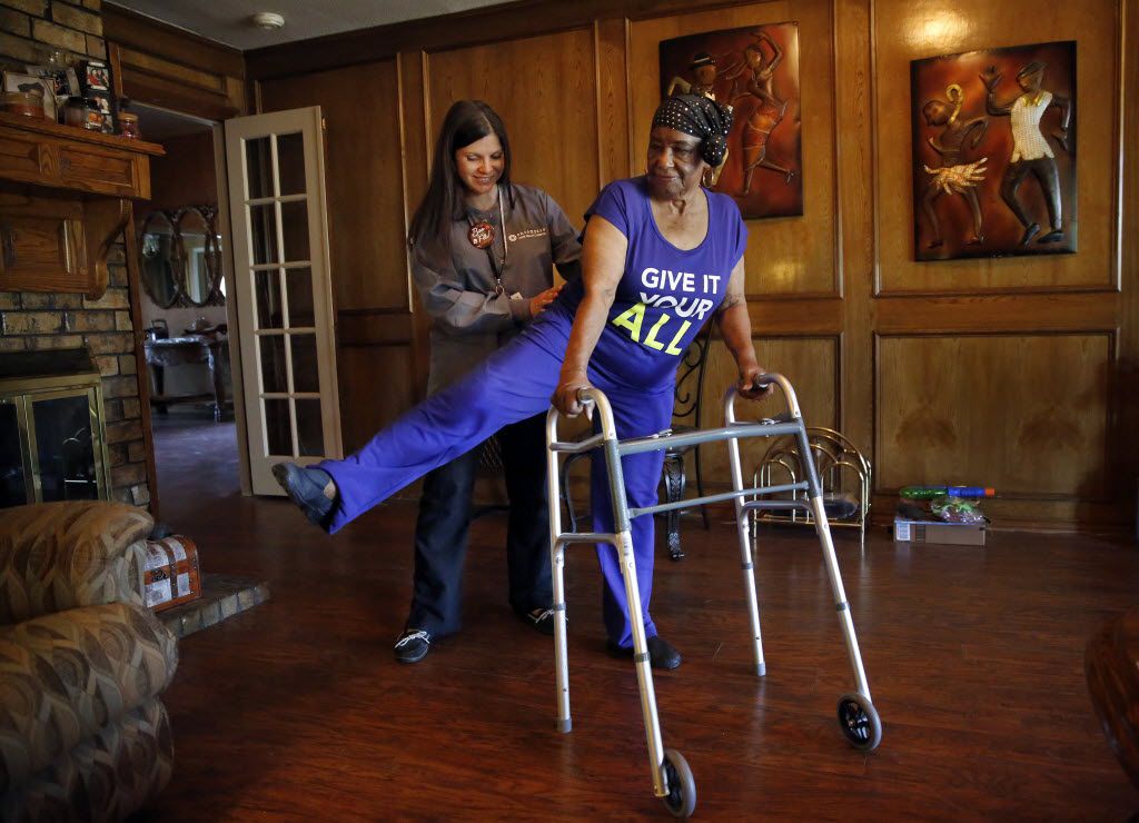 Encompass Health & Hospice physical therapist Bridgette McConnell (left) works with...
