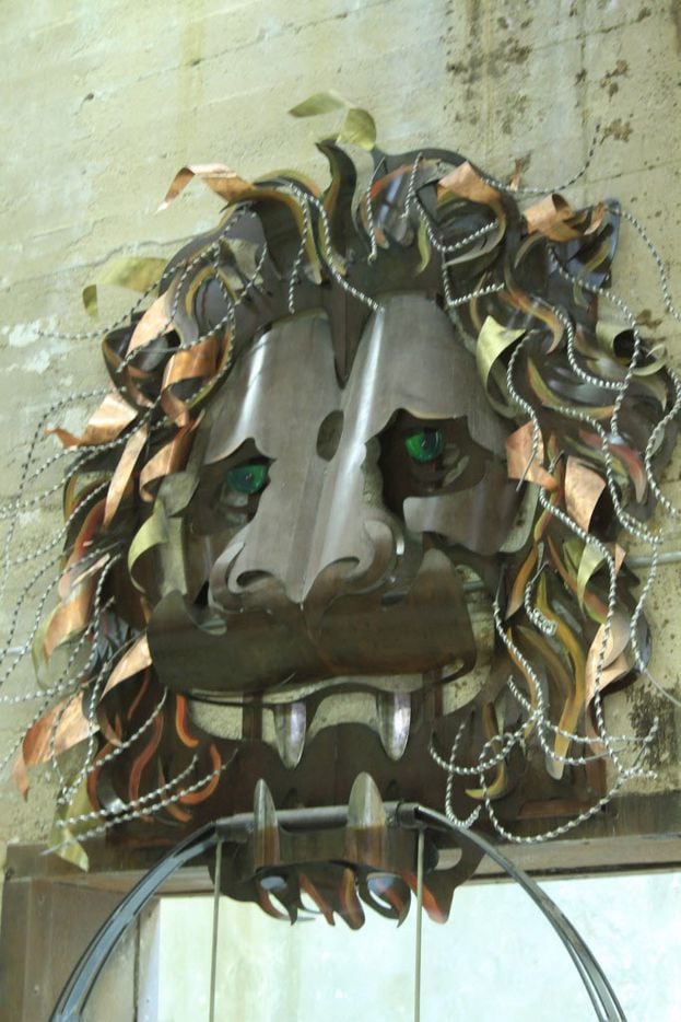 The oversized Lion Head Door Knocker Swing was created by Bryon Zarrabi, James Bauer and...