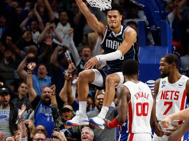 Dallas Mavericks guard Josh Green (8) dunks the ball during the second half of an NBA game...