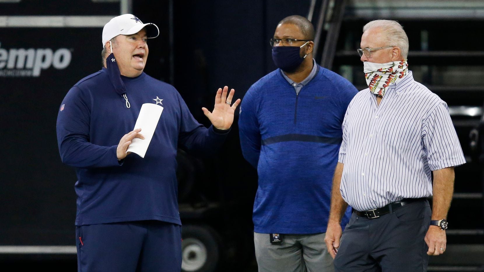 Dallas Cowboys head coach Mike McCarthy talks with Dallas Cowboys vice president of player personnel Will McClay and Dallas Cowboys executive vice president Stephen Jones during training camp at the Dallas Cowboys headquarters at The Star in Frisco, Texas on Friday, August 28, 2020.
