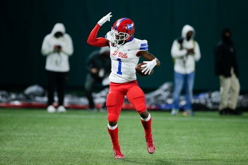 Duncanville senior running back Chris Hicks celebrates a touchdown during the first half of...