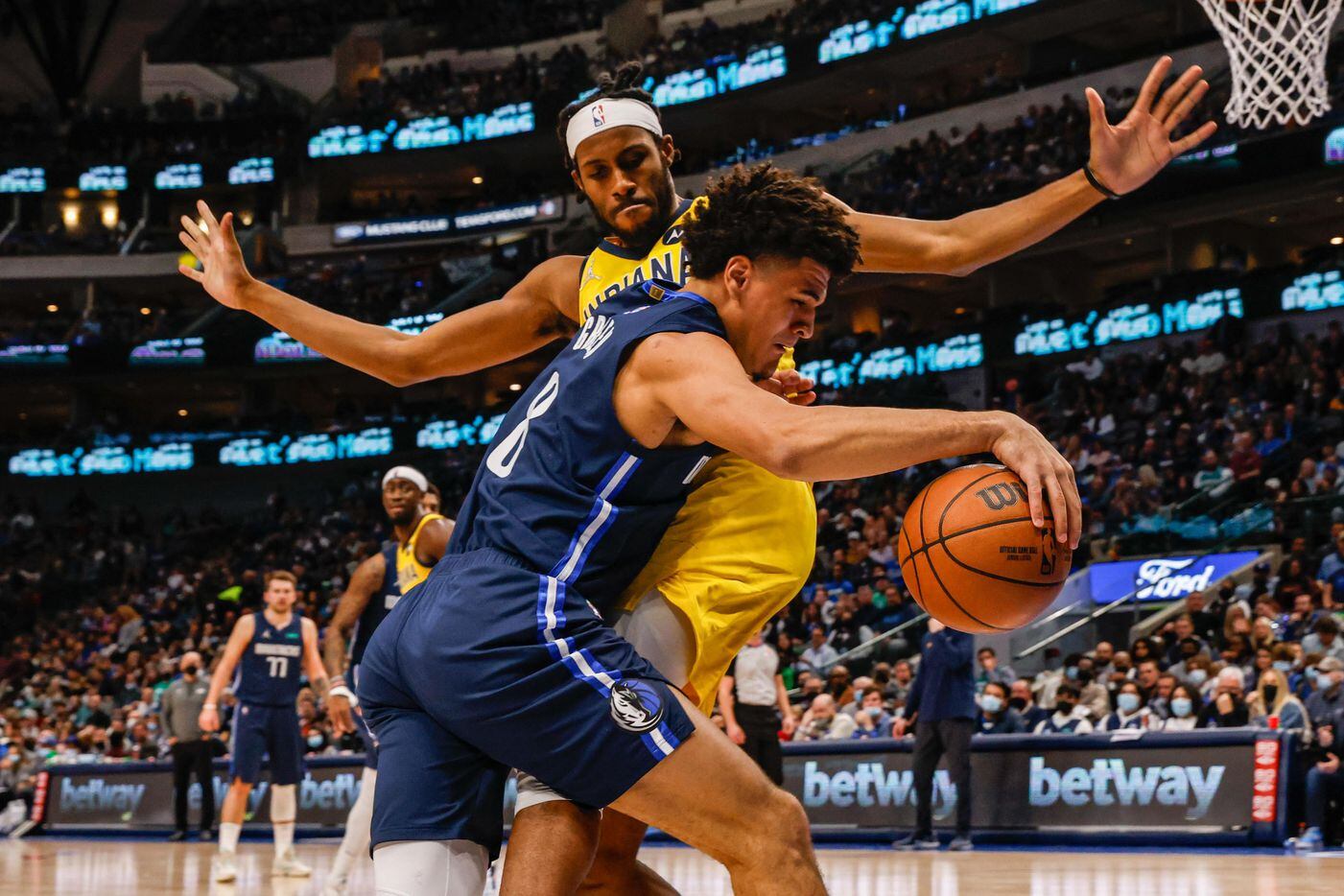 Dallas Mavericks forward George King (8) drives to the basket as Indiana Pacers forward Isaiah Jackson (23) tries to block him during the second half at the American Airlines Center in Dallas on Saturday, January 29, 2022.