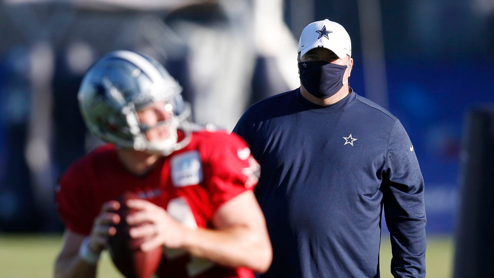 Dallas Cowboys head coach Mike McCarthy watches as Dallas Cowboys quarterback Andy Dalton...