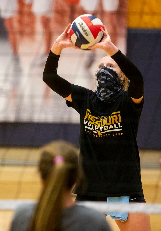 Flower Mound High School volleyball outside hitter Kaylee Cox serves the ball during...