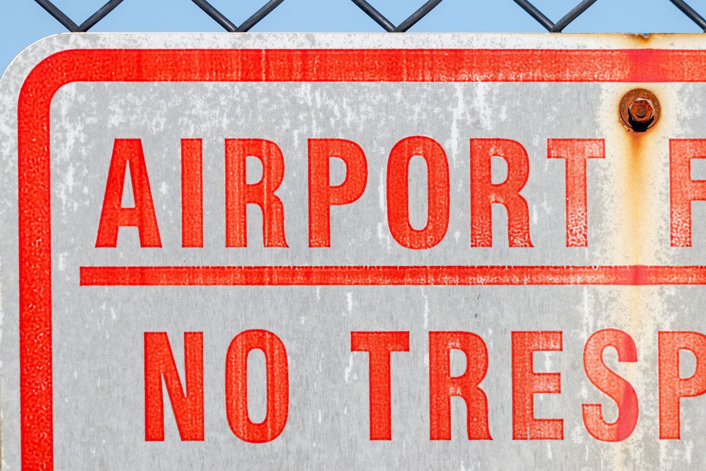 A sign marks the property line for the Dallas Executive Airport on Sunday, Nov. 13, 2022,...