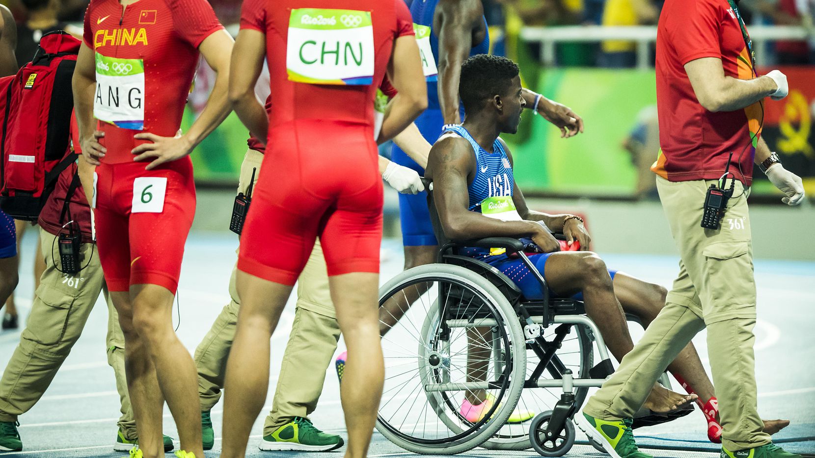 Trayvon Bromell of the USA leaves the track in a wheelchair after running the anchor leg of...