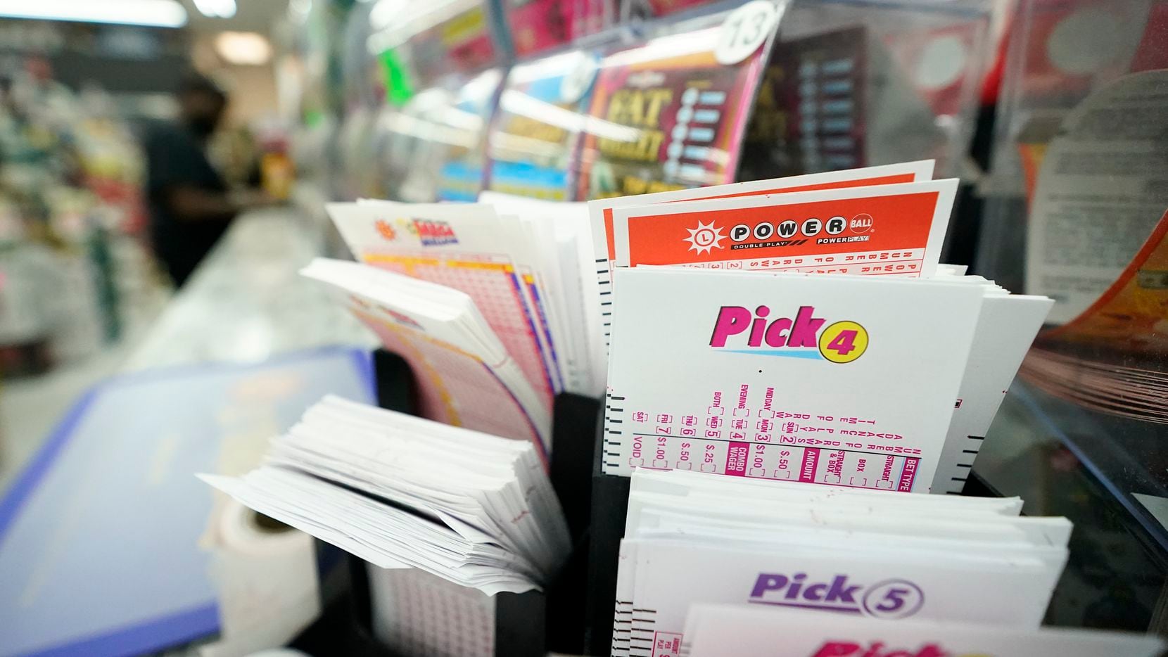 Lottery play stubs, including one for the Powerball, are seen on display at a liquor store...