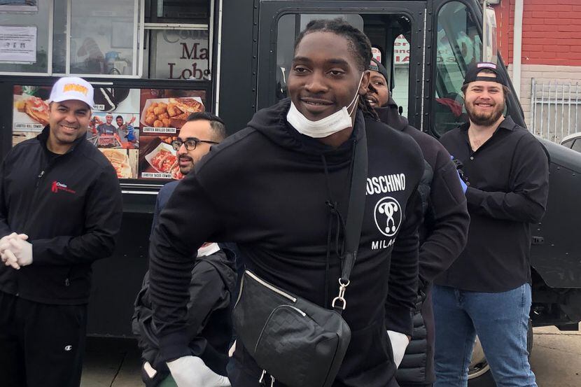 Cowboys defensive end DeMarcus Lawrence oversaw an event where food vendors were...