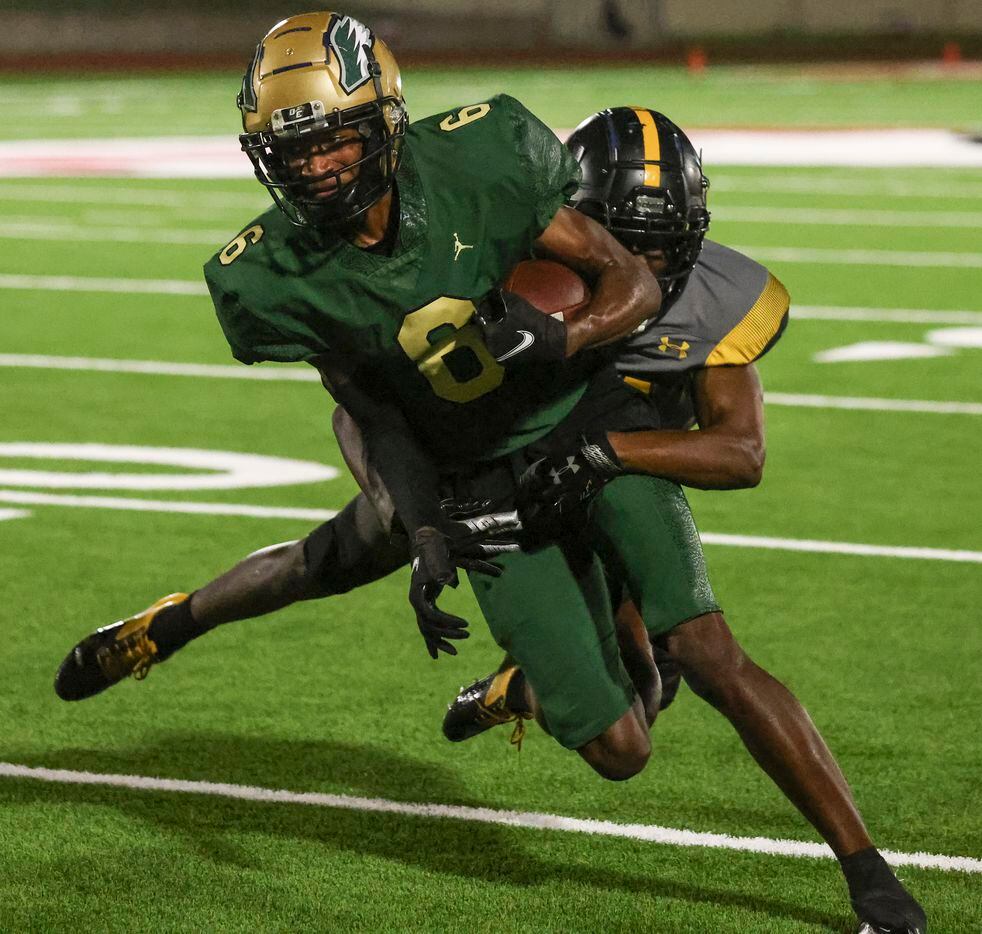DeSoto High School Crimson Mathis (6) gets tackled by St. Frances Academy Rischall Vaughns...