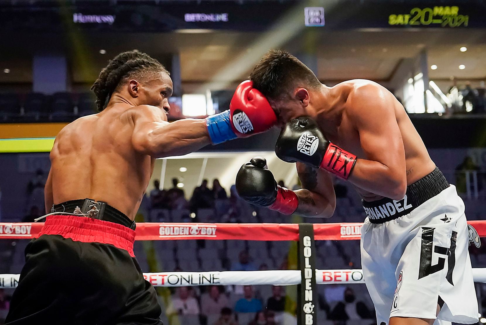 Alex Martin lands a punch on Luis Hernandez in a super lightweight bout at Dickies Arena on Saturday, March 20, 2021, in Fort Worth.