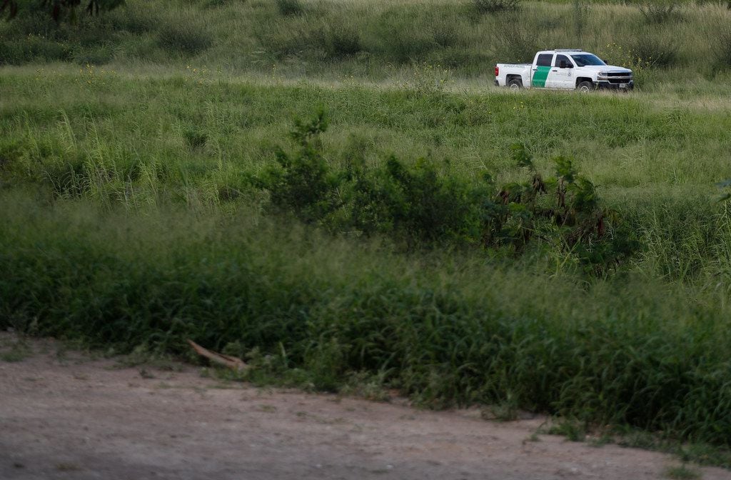 In this June 27, 2019, file photo, a U.S. Border Patrol car drives along the Rio Grande in...