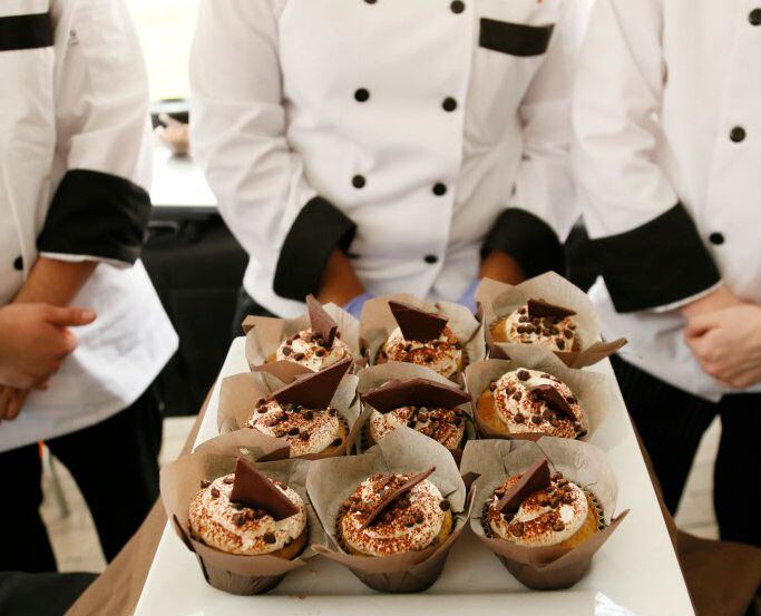 Tiramisu cupcakes are presented by student chefs at a cook off at the Latino Cultural Center...