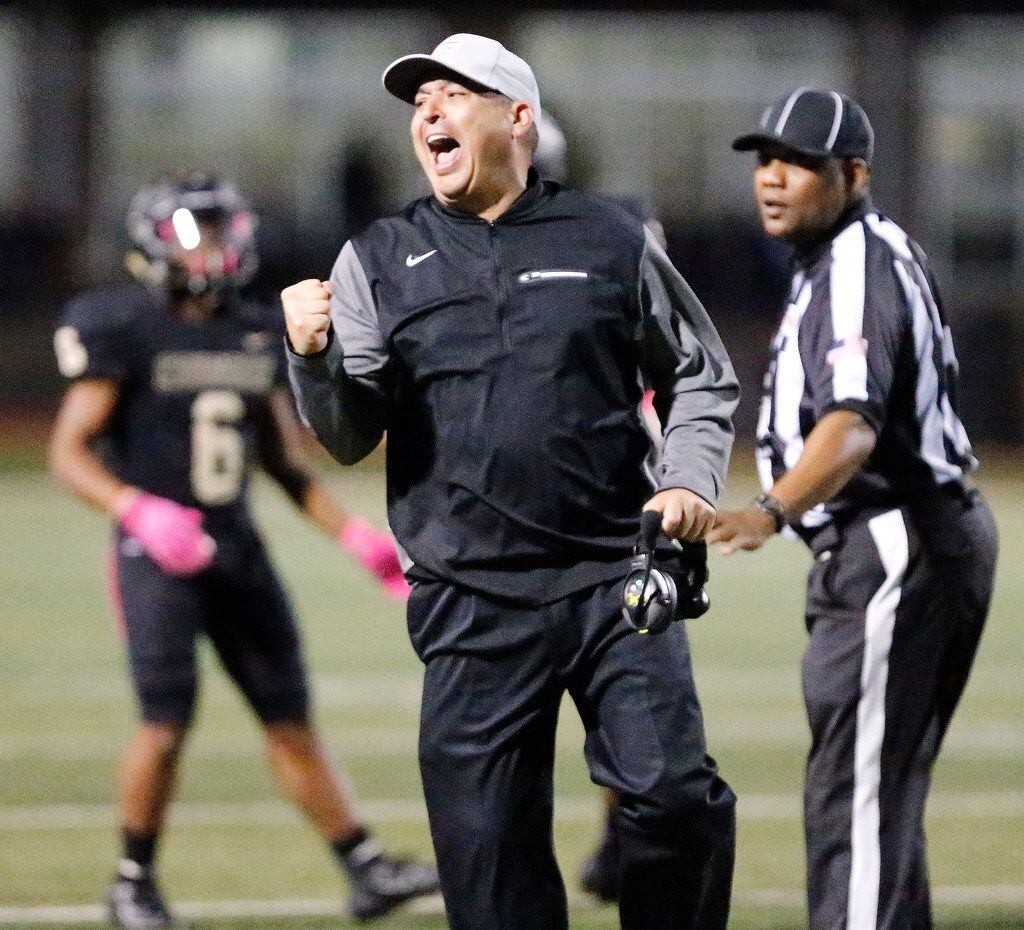 The Colony High School head coach Rudy Rangel reacts as he finds out his team would get...