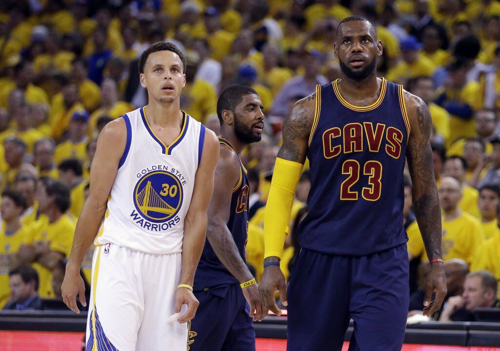 Golden State Warriors guard Stephen Curry (30) and Cleveland Cavaliers forward LeBron James...
