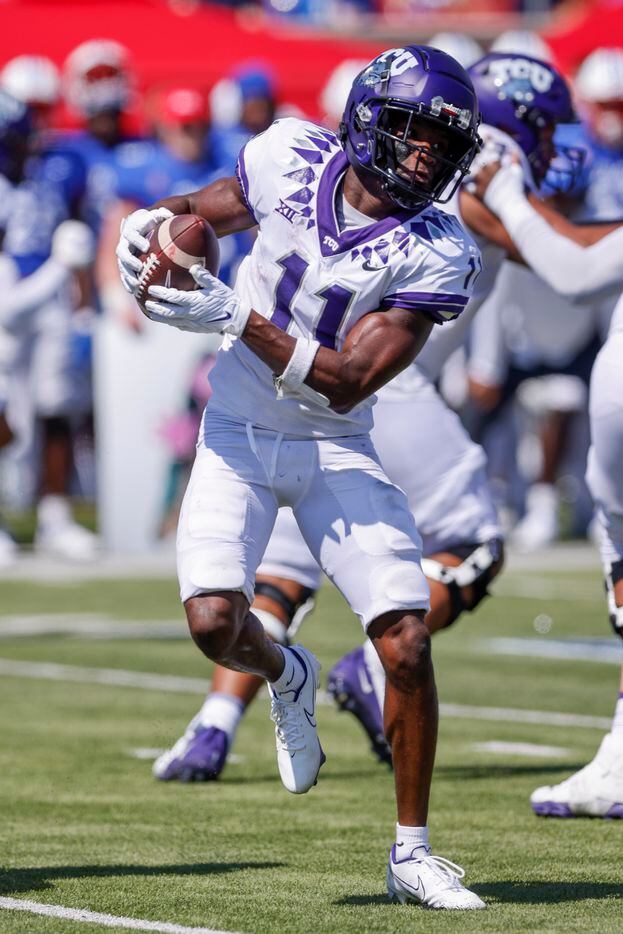TCU wide receiver Derius Davis (11) catches a pass for an 80-yard touchdown during the first...