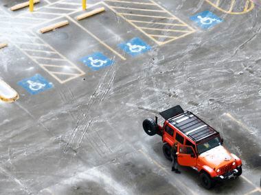 An icy mix covers the a Home Depot parking lot on Monday, Jan. 30, 2023, in Roanoke.  Dallas...