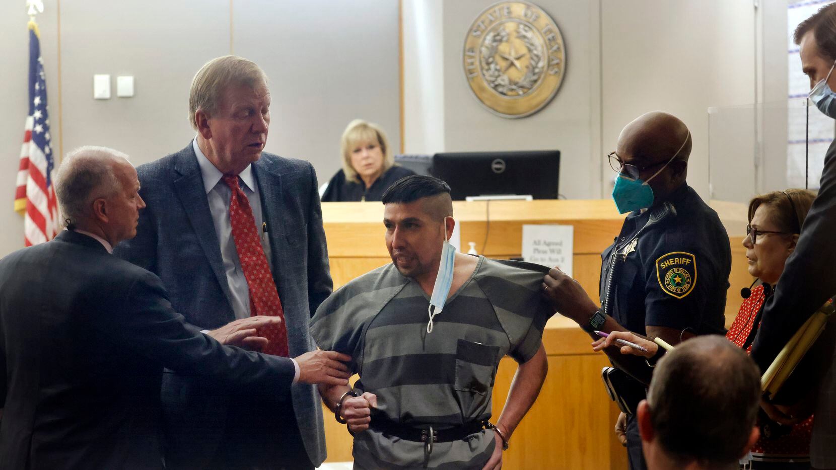 Convicted murderer Jaime Jaramillo is held back by a Dallas County deputy as he stepped...