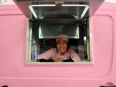 Krista Huynh helps fans place their order at the Hello Kitty Cafe Truck at The Shops at...