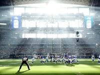 As the sun streams through the west retractable doors, New York Giants quarterback Mike Glennon (2) hands the ball off to running back Devontae Booker (28) in the third quarter against the Dallas Cowboys at AT&T Stadium in Arlington, Texas, Sunday, October 10, 2021.