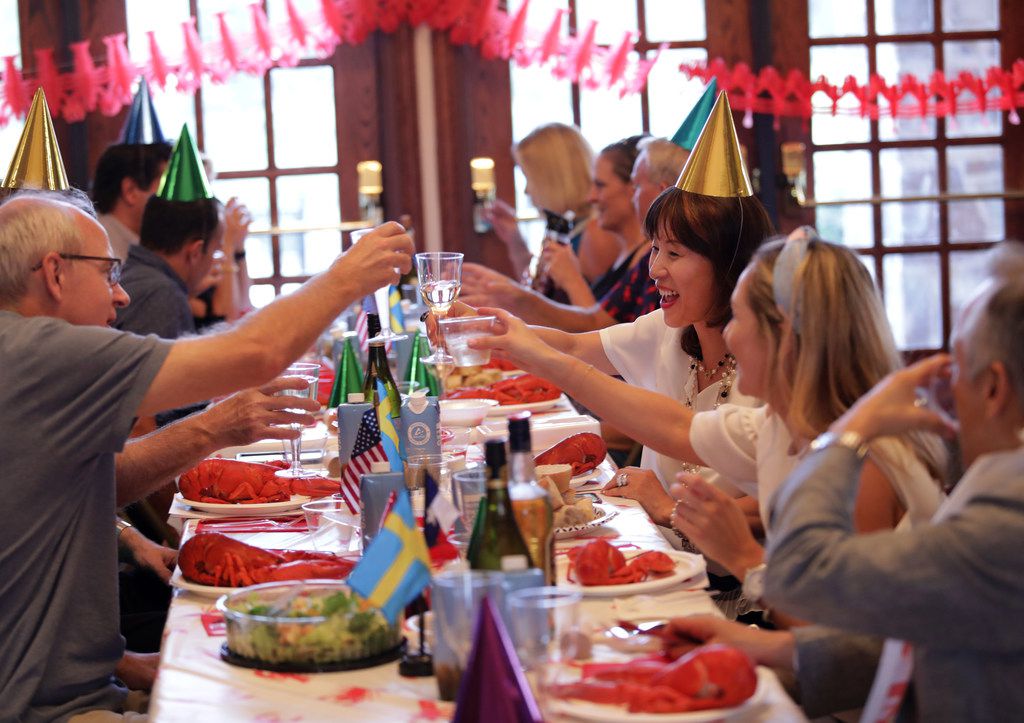 Guests enjoy traditional Swedish food and drinks during the Swedish American Chamber of Commerce Swedish lobster feast at the Heritage Lakes Club House in Frisco on Sept. 7, 2019. 