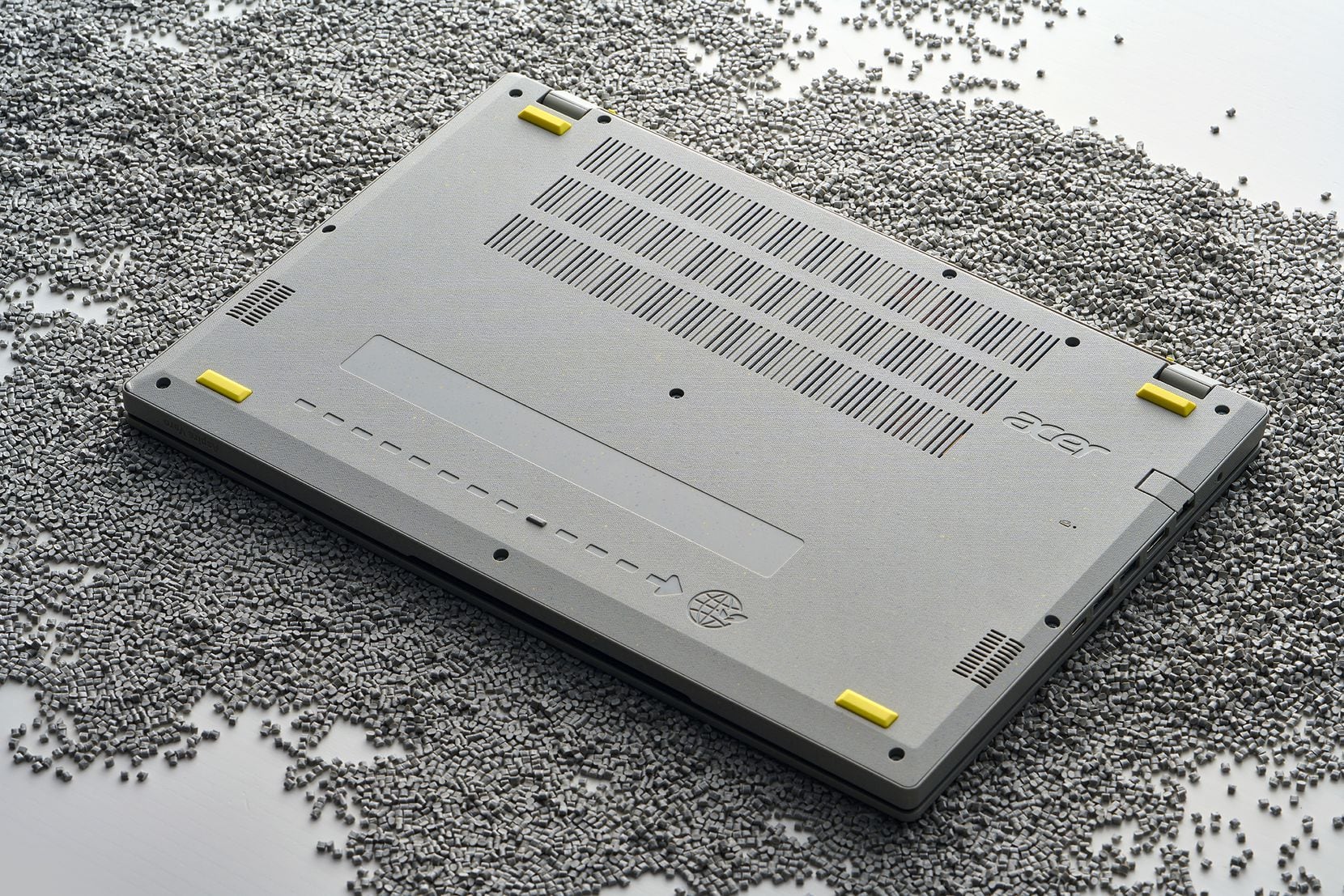 The Acer Aspire Vero has a gray case flecked with dark gray and yellow.