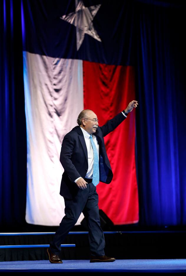 Gilberto Hinojosa acknowledges the cheers as he walks on-stage winning and retaining his...