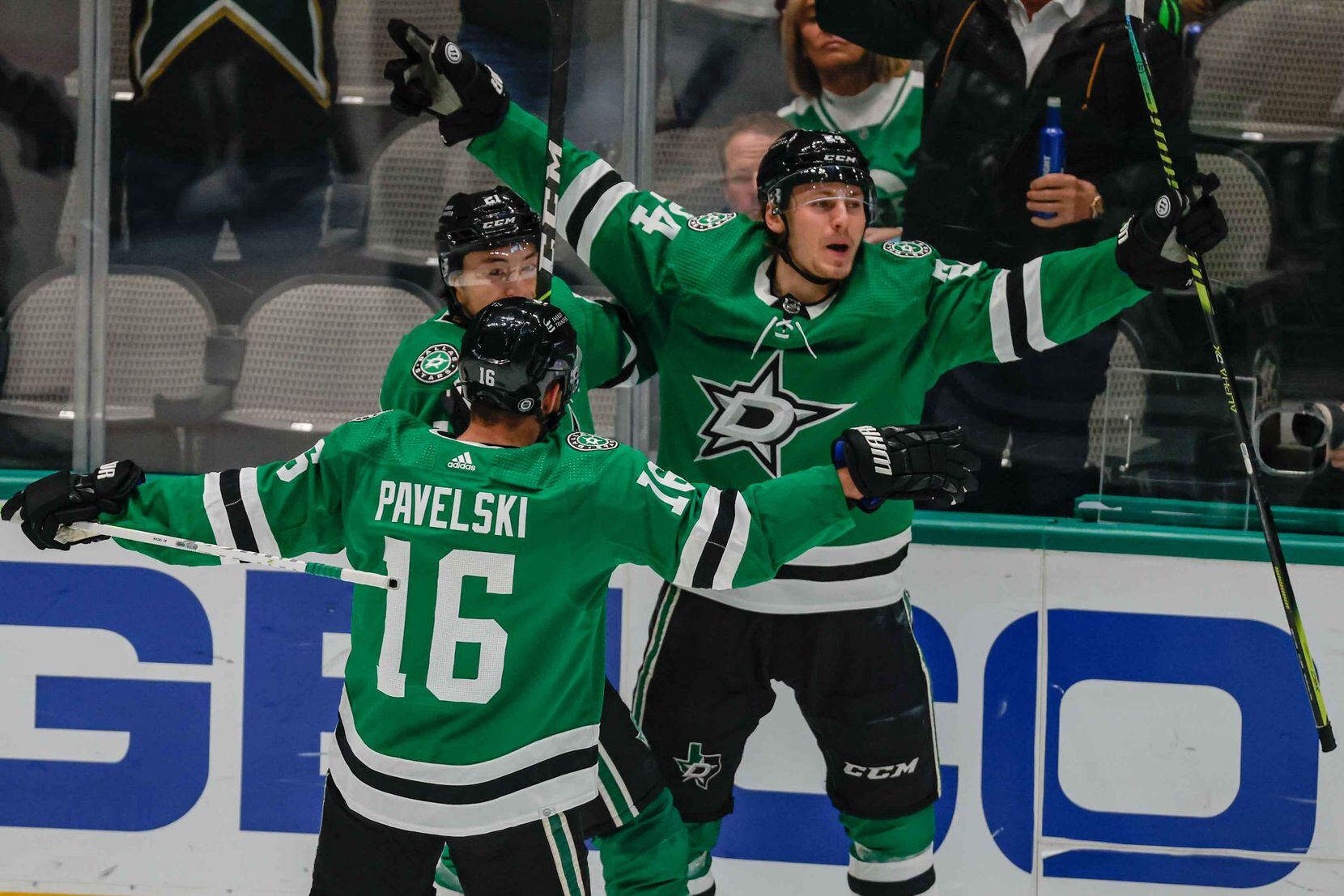 Dallas Stars left wing Roope Hintz (24) celebrates his goal against the Arizona Coyotes with his teammates left wing Jason Robertson (21), center Joe Pavelski (16) during first period at the American Airlines Center in Dallas on Monday, December 6, 2021. (Lola Gomez/The Dallas Morning News)